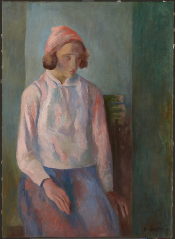 Ujęcie lica. Portret młodej kobiety siedzącej na krześle.