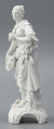 S/CS/1476/ML - Figurka z białej szkliwionej porcelany przedstawiajaca  kobietę stojacąna niskim trójdzielnym cokole. Kobieta ma długie włosy upięte w koczek, ubrana jest w fałdzistą spódnicę przewiązaną poniżej bioder, gorset z baskinką i głębokim dekoltem, bluzkę z bufiastmi rękawami do łokci, na ramionach zawiazaną chustkę, ma bose stopy. Prawą ręką trzyma płaski kosz z owocami oparty na biodrze, w lewej ugiętej ma jabłko. 
  