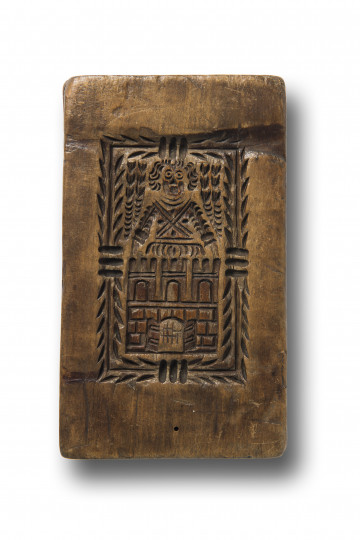 Jedna ze stron formy z negatywowym rytem przedstawiającym herb Torunia, czyli mur z otwartą bramą miejską, trzema basztami oraz aniołem symbolizującym opiekę nad miastem. Całość w prostokątnym ozdobnym obramowaniu.